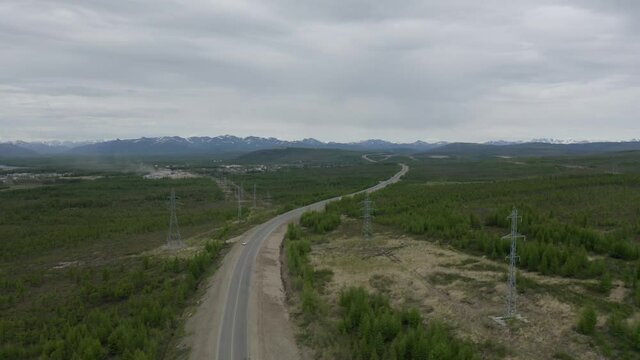 Flight on a drone over the Kolyma highway connecting the villages of Palatka and Stekolniy. The Far East of Russia.
