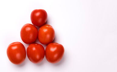 Ripe red tomatoes isolated on white background.