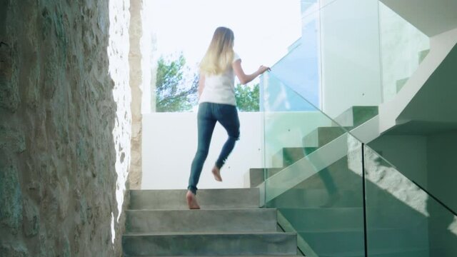 WS TS Girl (12-13) running up stairs 