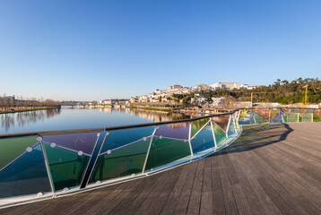 historic Coimbra cityscape with university at top of the hill in the evening, Portugal