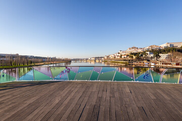 historic Coimbra cityscape with university at top of the hill in the evening, Portugal