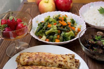 Rice with soy sauce and boiled vegetables close-up on a decorative background. Rice Dish. Fried...
