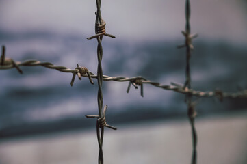 Close up of a barbed wooden fence
