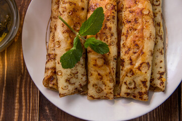 fried pancakes and strawberries closeup on a wooden table. Dessert. Healthy breakfast. Proper nutrition