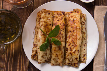 fried pancakes and strawberries closeup on a wooden table. Dessert. Healthy breakfast. Proper nutrition