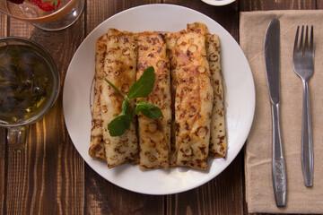 fried pancakes and strawberries closeup on a wooden table. Dessert. Healthy breakfast. Proper nutrition