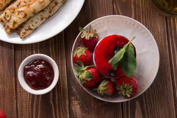 dessert with strawberries close-up on a decorative background. Strawberry jelly. 
Delicate Strawberry Cheesecake On A White Plate
