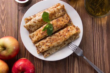 fried pancakes and strawberries closeup on a wooden table. Dessert. Healthy breakfast. Proper nutrition