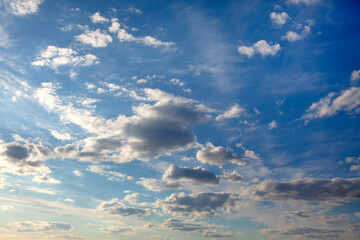 soft clouds at blue heaven with sun rays 