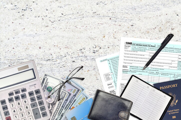 IRS form 1040 Individual income tax return lies on flat lay office table and ready to fill. U.S....