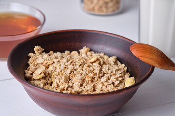 Muesli in a plate for breakfast on a white table.