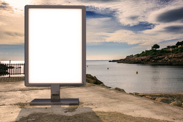 Blank advertising mockup in the street . Poster billboard on the beach background