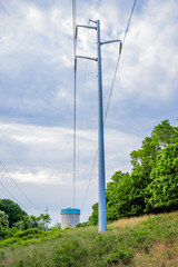 Power Plant and lines towers in woods trail