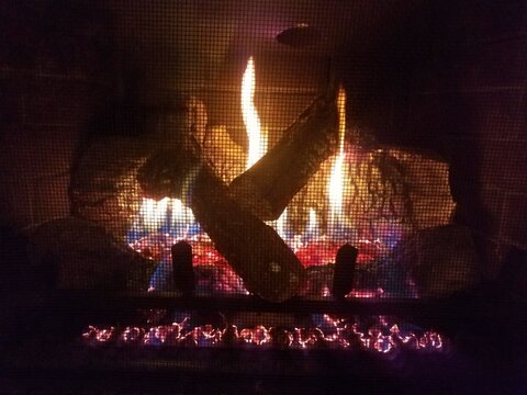 Gas Fireplace With Flame And Fire And Logs And Metal Grate