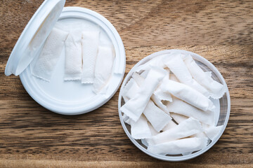 Box of swedish nicotine , snus on wood background