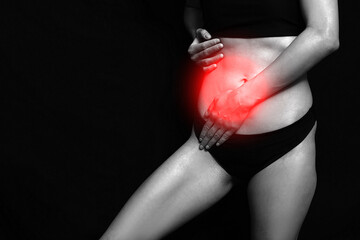 Gynecology concept. Young woman suffering from pain