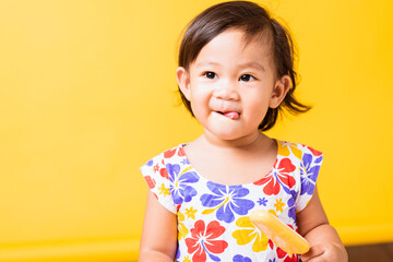 Happy portrait Asian baby or kid cute little girl attractive laugh smile wearing dick pattern shirt...