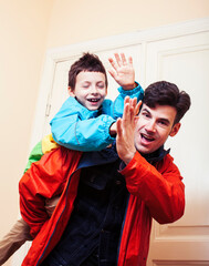 Fototapeta premium faher and son together having fun at home, lifestyle happy family, people at home