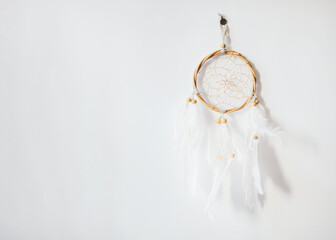 Dreamcatcher Photo template with copy space Handmade dreamcatcher hanging on a white wall Front view photo
