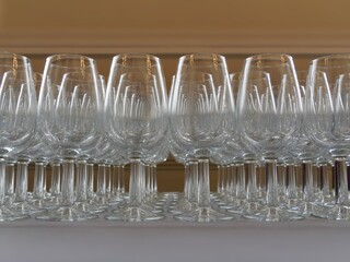 Rows of empty glasses close up view