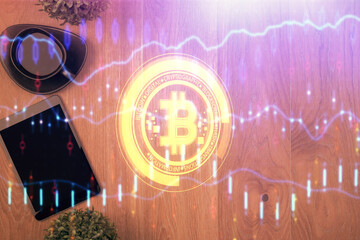 Double exposure of blockchain theme hologram over table with phone. Top view. Crypto technology...