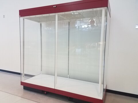 An Empty Red And Glass Display Case