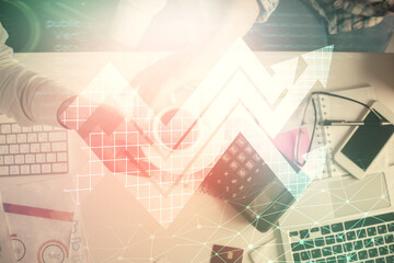 Obraz premium Double exposure of man and woman working together and arrows drawing. Computer background. Top View. Growth concept.