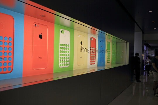 HONG KONG - OCT 25: New iphone 5c signboard display in Hong Kong on October 25, 2013 . Apple's reportedly cutting production of its low-cost iPhone 5C, but raising production for  iPhone 5S