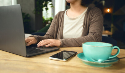 Business Modern women freelancer with laptop and coffee