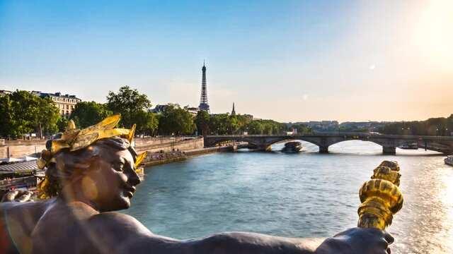 Traffic on Seine River, Eiffel Tower and statue on Pont Alexandre III