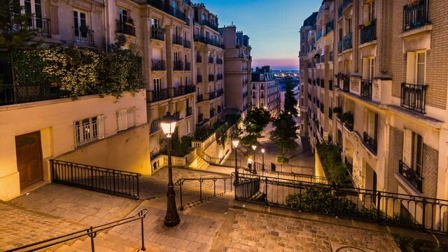  Stairs in Montmartre illuminated by street lights at dawn