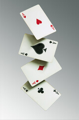 Playing cards falling in a row.