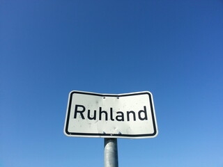 Road sign with blue sky