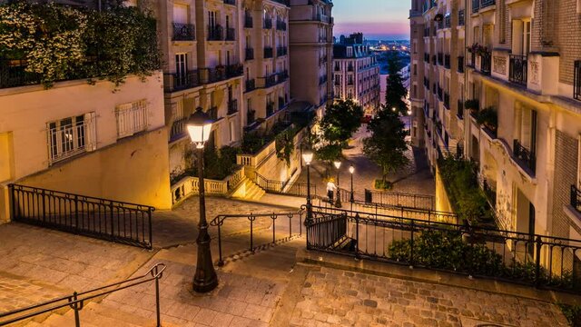  Stairs in Montmartre illuminated by street lights at dawn