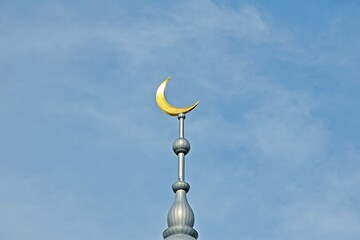 Fototapeta na wymiar Islamic golden crescent on a blue sky