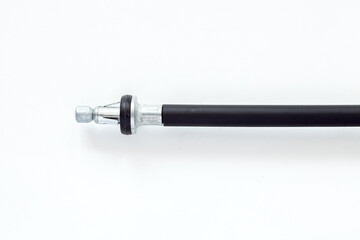 twisted steel parking brake cable in a black case, car spare part isolated on a white background.