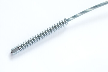 Steel rope twisted with spring spare part for car and motobike close up isolated on white background.