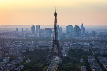 View of Paris with Eiffel Tower from Montparnasse building. Eiffel tower view from Montparnasse at sunset, view of the Eiffel Tower and La Defense district in Paris, France.