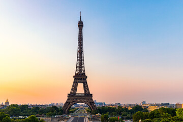 Fototapeta na wymiar Eiffel tower in summer, Paris, France. Scenic panorama of the Eiffel tower under the blue sky. View of the Eiffel Tower in Paris, France in a beautiful summer day. Paris, France.
