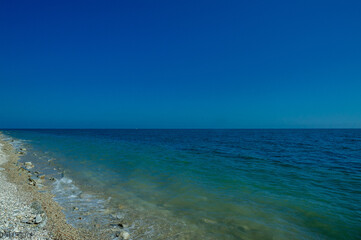 Fototapeta na wymiar pebble sea shore during the day