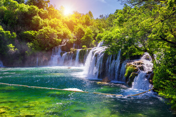 Fototapeta na wymiar Beautiful Skradinski Buk Waterfall In Krka National Park, Dalmatia, Croatia, Europe. The magical waterfalls of Krka National Park, Split. An incredible place to visit near Split, Croatia.