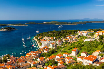 Obraz premium View at amazing archipelago in front of town Hvar, Croatia. Harbor of old Adriatic island town Hvar. Popular touristic destination of Croatia. Amazing Hvar city on Hvar island, Croatia.