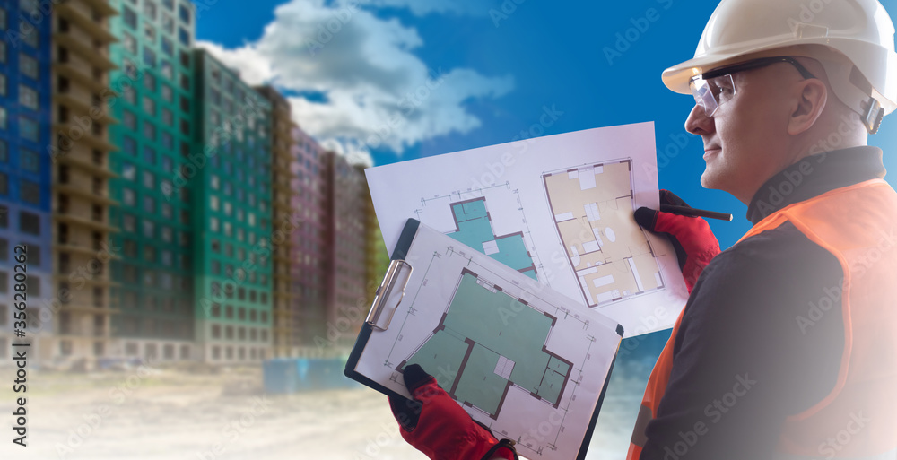 Poster civil engineer. a man in a white helmet with construction documentation in his hands. builder on the