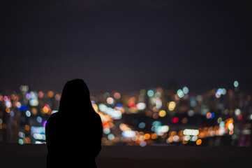people and night traffic in the city