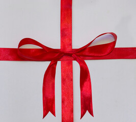 red ribbon withfour bow on a white background