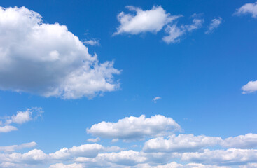 Naklejka na ściany i meble Blue sky background with white clouds.