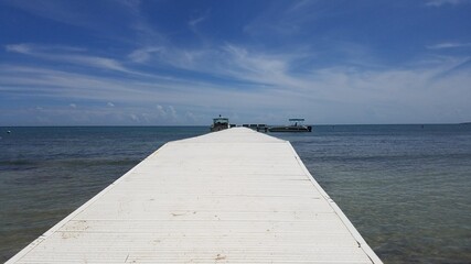 long white boardwalk or pier on calm water in Guanica, Puerto Rico