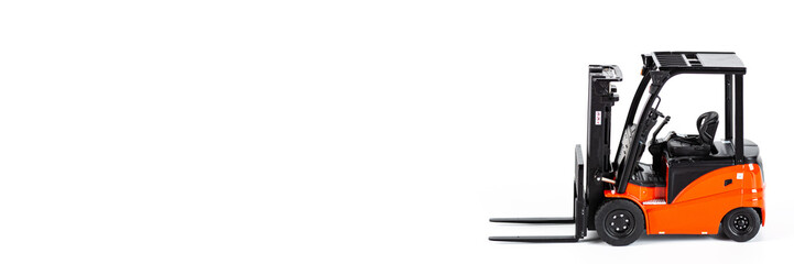 Red toy forklift loader isolated on white background. Horizontal web banner with Copy Space for text. moving service and distribution products. Delivery production. Logistics and industrial concept.