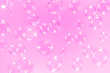 Beautiful pink soap bubbles float as background.