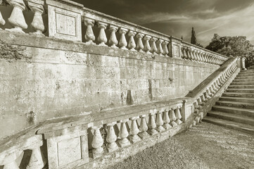 Stone baroque baluster and stairway in garden